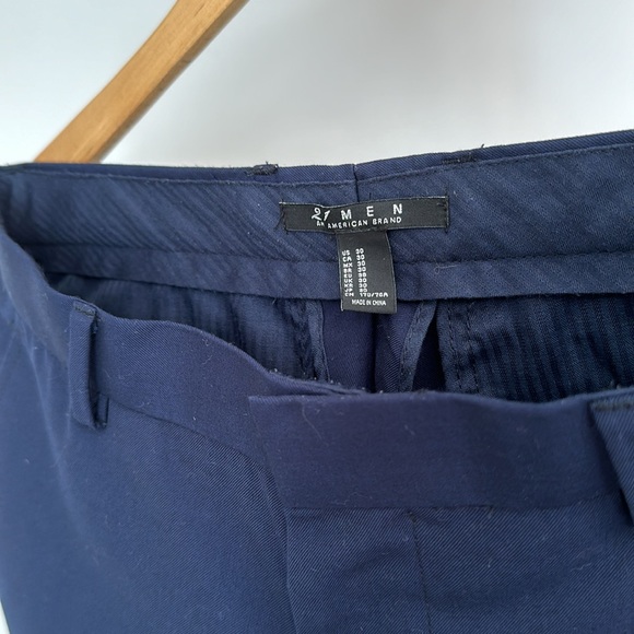 Navy dress pants with thin black stripe down outside of leg. - Picture 2 of 5